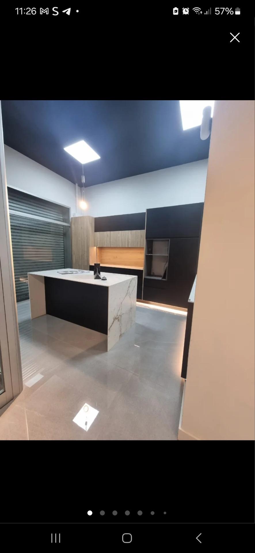 Foto 4 de Cambio cocina exposición con Neolith Abu Dhabi y Dekton, combinación negro con roble.